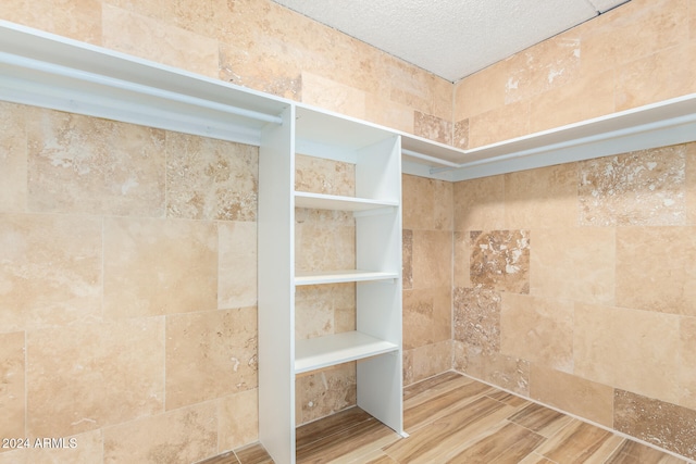 bathroom with hardwood / wood-style floors