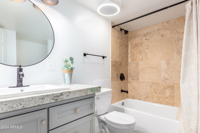 full bathroom with vanity, toilet, and shower / bath combo with shower curtain