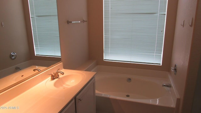 bathroom featuring a bath and vanity