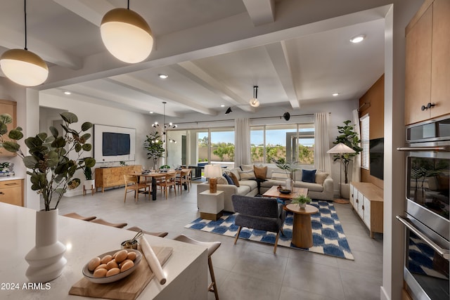 living room with beamed ceiling and ceiling fan with notable chandelier