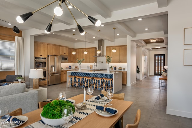 dining space featuring beamed ceiling, recessed lighting, and baseboards