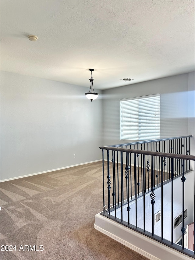 corridor featuring carpet flooring