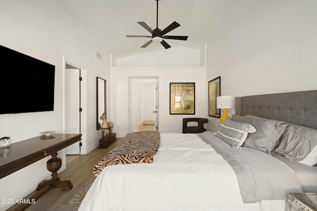 bedroom featuring visible vents, light wood-style floors, a ceiling fan, high vaulted ceiling, and baseboards