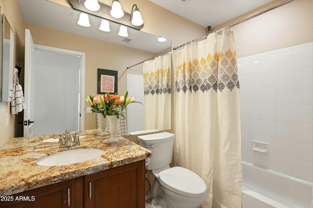 bathroom featuring toilet, visible vents, shower / bath combo with shower curtain, and vanity