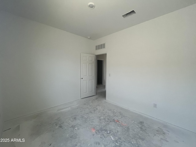 spare room with visible vents and concrete floors