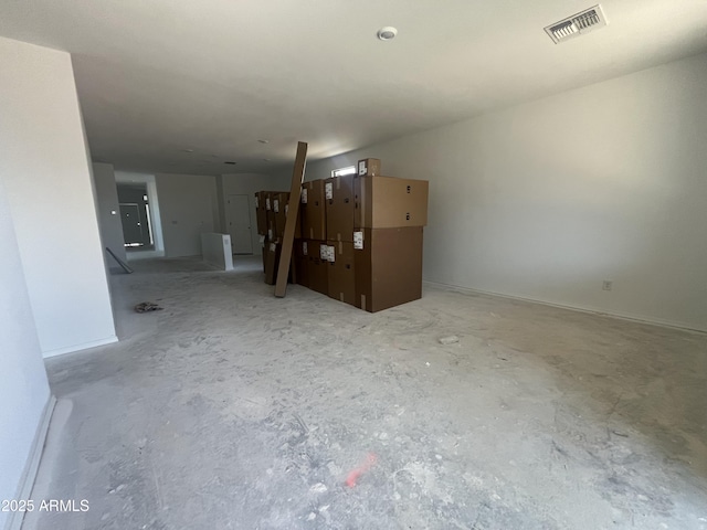 empty room with visible vents and unfinished concrete floors