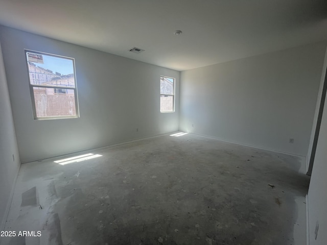 spare room featuring visible vents