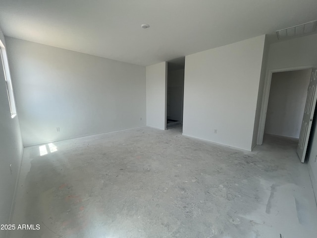 unfurnished room featuring visible vents and unfinished concrete floors