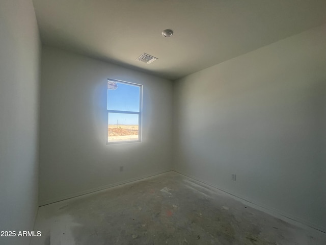 unfurnished room with visible vents and unfinished concrete floors