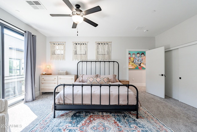 carpeted bedroom featuring ceiling fan