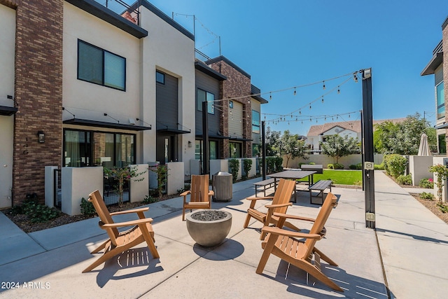 view of patio with a fire pit