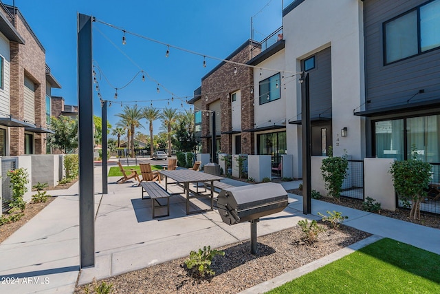 view of home's community with a patio area