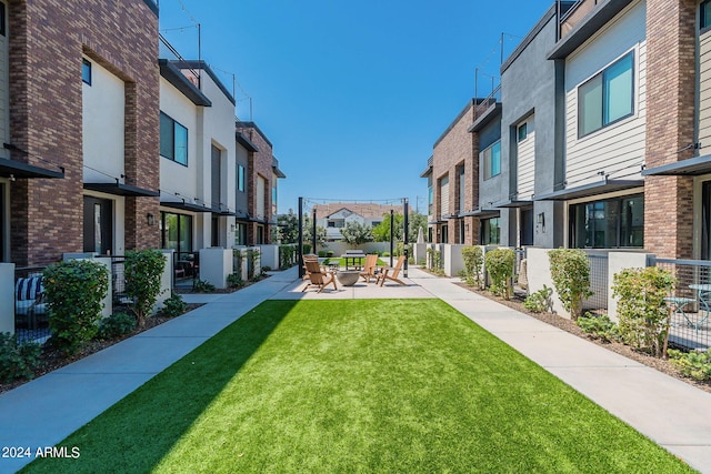 surrounding community featuring a yard and a patio area