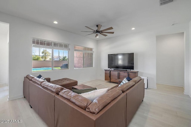 living room with ceiling fan, light wood-type flooring, visible vents, and recessed lighting