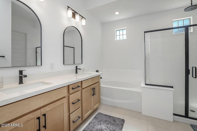 full bathroom with a sink, a shower stall, and tile patterned floors