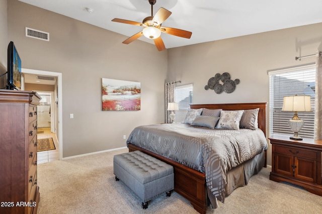 bedroom with light colored carpet and ceiling fan