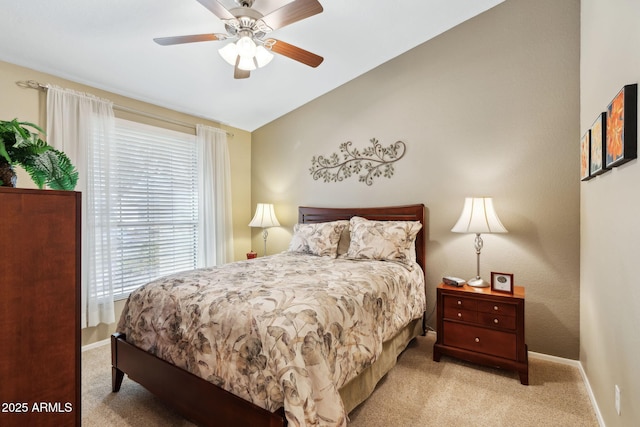 bedroom featuring lofted ceiling, light carpet, and ceiling fan