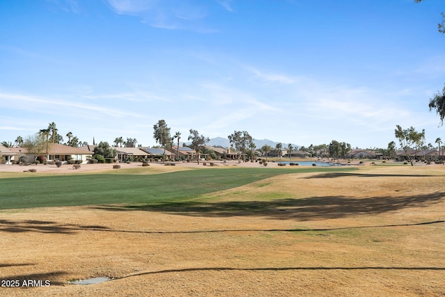 view of community featuring a yard and a water view