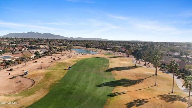 birds eye view of property with a water and mountain view