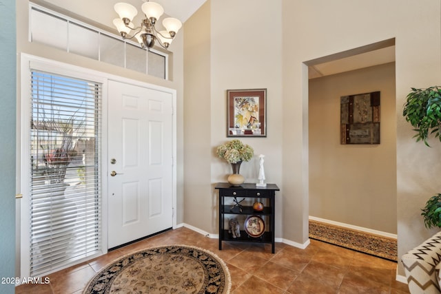 entrance foyer featuring an inviting chandelier and tile patterned floors