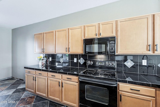 kitchen featuring black appliances, light brown cabinetry, and backsplash