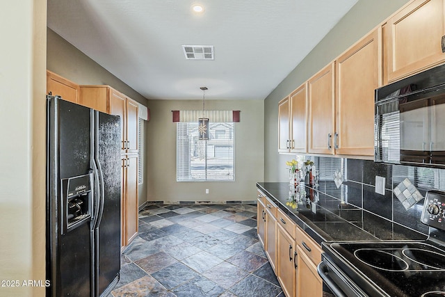 kitchen with light brown cabinets, stone tile floors, visible vents, decorative backsplash, and black appliances