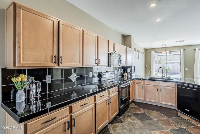 kitchen with tasteful backsplash, dark countertops, visible vents, a sink, and black appliances