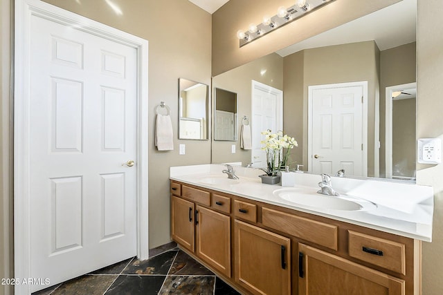 full bath featuring a sink and double vanity