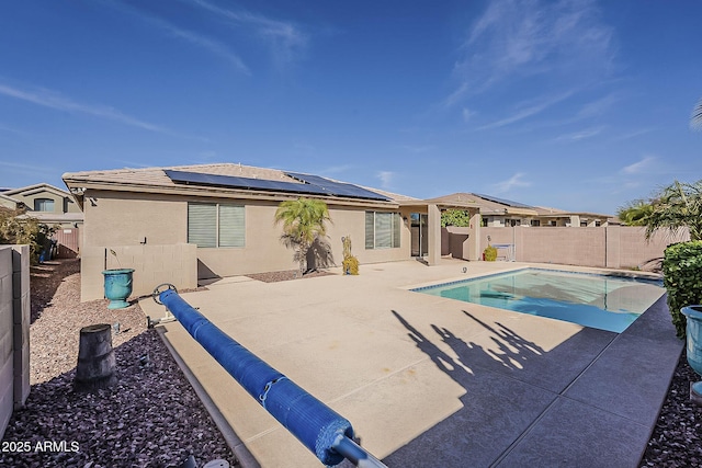 view of swimming pool with a patio, a fenced backyard, and a fenced in pool