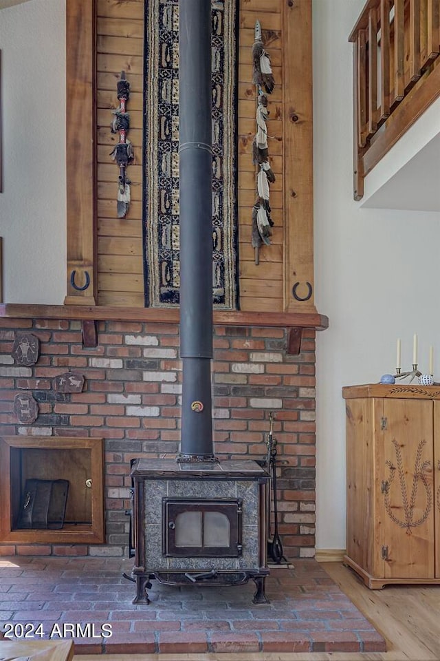 interior details featuring hardwood / wood-style flooring and a wood stove