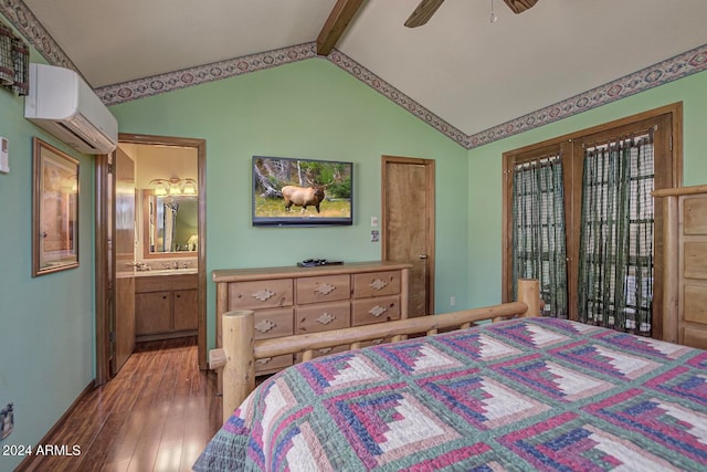 bedroom featuring an AC wall unit, ceiling fan, hardwood / wood-style flooring, vaulted ceiling with beams, and ensuite bath