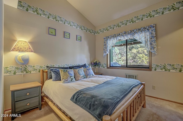 carpeted bedroom with vaulted ceiling