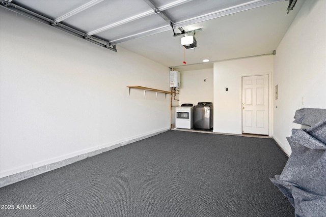 garage with a garage door opener, separate washer and dryer, and water heater