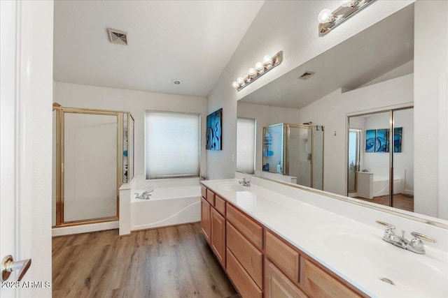 462 W Myrtle Dr, Chandler, AZ 85248 - full bathroom featuring lofted ceiling, a stall shower, a bath, wood finished floors, and double vanity
