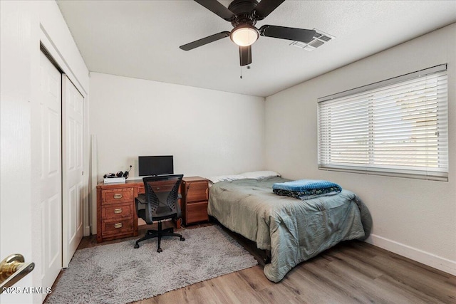462 W Myrtle Dr, Chandler, AZ 85248 - bedroom with light wood-style floors, a closet, baseboards, a ceiling fan, and a desk