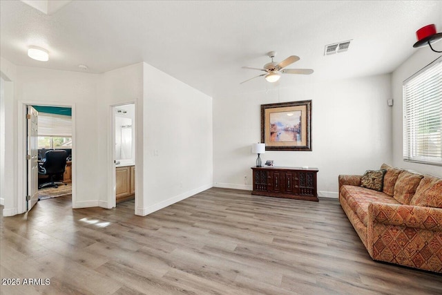 462 W Myrtle Dr, Chandler, AZ 85248 - living room with light wood finished floors, an office area, a ceiling fan, and baseboards