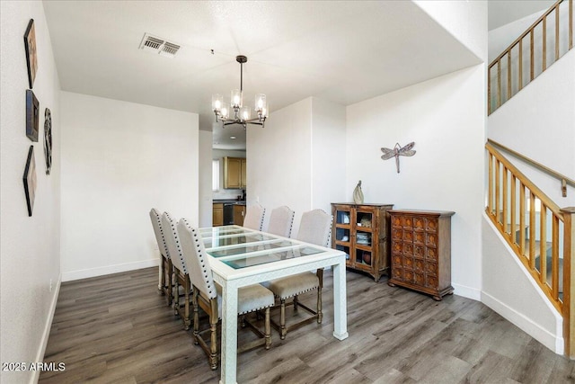462 W Myrtle Dr, Chandler, AZ 85248 - dining area with wood finished floors, a chandelier, and baseboards
