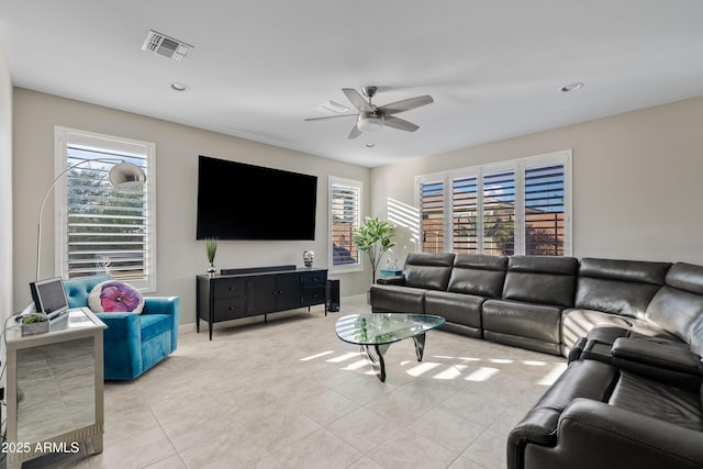 living room with light tile patterned floors and ceiling fan