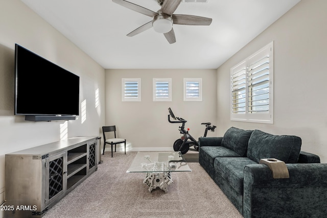 living room with light colored carpet and ceiling fan