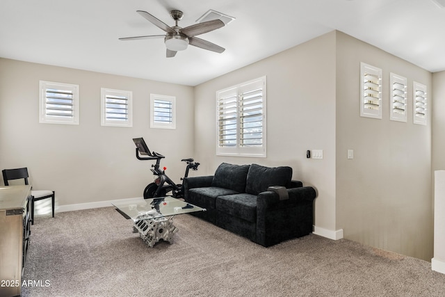 exercise room featuring carpet flooring and ceiling fan