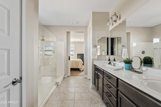 bathroom with vanity, tile patterned flooring, and a shower