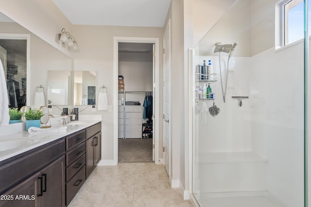 bathroom with vanity, tile patterned floors, and walk in shower