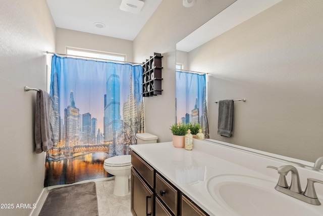 bathroom with vanity, a shower with shower curtain, and toilet