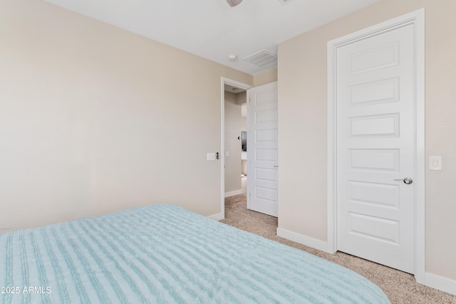 unfurnished bedroom featuring light carpet