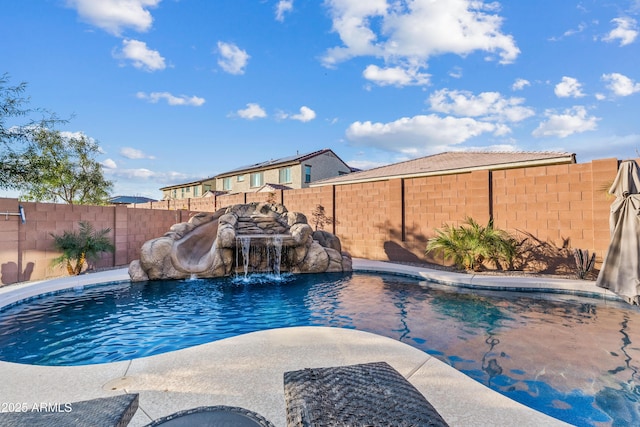 view of swimming pool featuring pool water feature