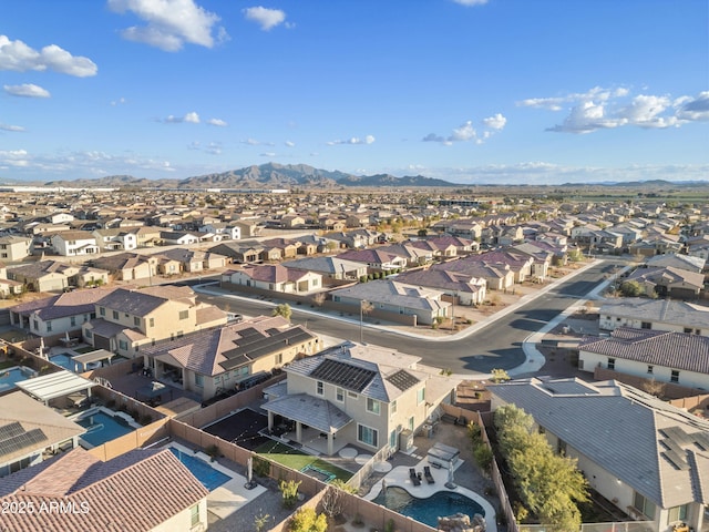 birds eye view of property with a mountain view