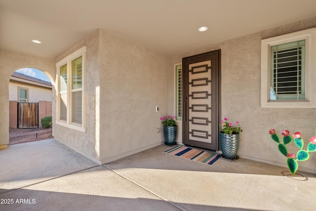 entrance to property with a patio