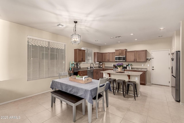 dining area with visible vents, recessed lighting, baseboards, and light tile patterned flooring