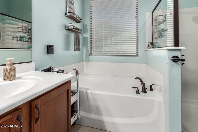 full bathroom featuring vanity, tile patterned floors, and a bath