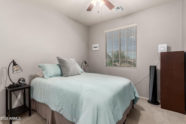 bedroom featuring baseboards, carpet, a ceiling fan, and visible vents